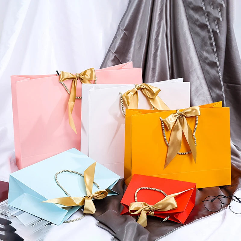Wholesale Paper Gift Bags with Ribbon Bow Recycled Wedding Shopping Bags with Handles Clothing Cosmetic Jewelry Packaging Bags